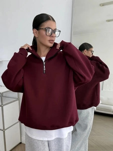 Women's burgundy oversized half-zip sweatshirt with a relaxed drop shoulder design