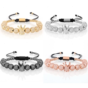 Detail showing crown beaded bracelets in gold, silver, black, and rose gold finishes