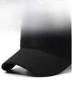 Detail of a black sports cap showing reinforced multi-stitch visor and cotton twill fabric