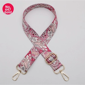 Detail of 38mm wide pink bohemian style strap with golden metal hooks for handbags