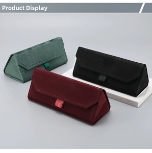 Detailed view of plush velvet triangular folding glasses cases in dark green, black and wine red