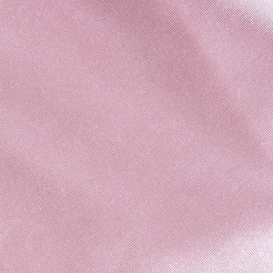 Texture macro du tissu mauve montrant le motif de fibre tissé et le détail textile doux