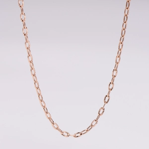 Macro shot of rose gold stainless steel twisted chain necklace with textured oval links