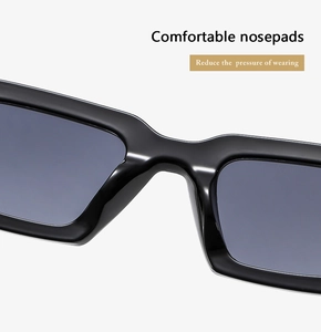 Detail view of smooth integrated nose pads on black square sunglasses for comfort