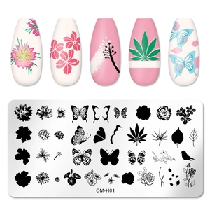 Macro detail of stainless steel nail stamping plate OM-H01 with tropical and butterfly patterns
