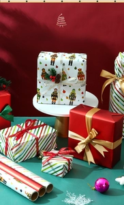 Detail of Christmas nutcracker gift wrapping paper and love is eternal ribbon on gift boxes