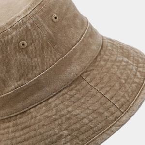 Detailed close-up of heavy washed cotton bucket hat showing stitching and eyelets