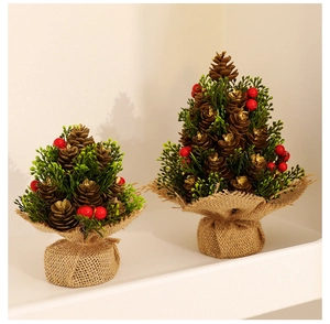 Mini pine cone Christmas trees with red berries and burlap base on a shelf