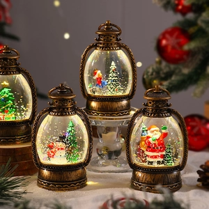 Close-up of vintage bronze Christmas lanterns with Santa Claus and snowman scenes