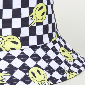 Checkered bucket hat with yellow melting smiley face and reversible foldable sun protection