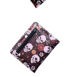 Close-up of gothic spider and skull pattern print on a premium zippered coin purse
