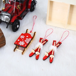 Wooden Christmas sled and skis hanging set with red snowflake patterns and white fur trim
