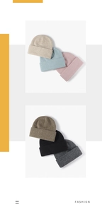 Close-up of fluffy knitted beanies in multiple colors showcasing soft wool texture
