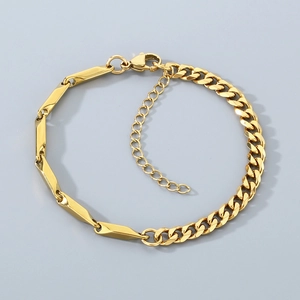 Detail of gold Cuban link bracelet featuring geometric facet design and lobster clasp