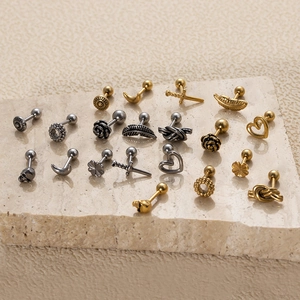 Assorted stainless steel screw-back ear studs with gold and silver punk style charms