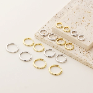 Detailed view of S925 sterling silver hoop earrings in gold and silver finishes