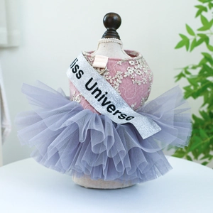 Detailed view of pink lace pet dress with grey tulle skirt and Miss Universe ribbon