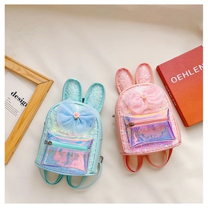 Detail of sequin kids backpacks with rabbit ears, mesh bows and laser pocket texture