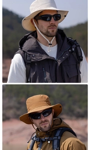 Close-up of hiking hats in beige and khaki showing wide brims and adjustable wind cords