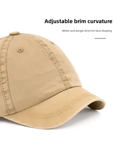 Detail of khaki cotton baseball cap showing foldable brim and fine stitching craft
