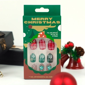 Christmas soft gel nails with festive red green plaid patterns and snowflake designs