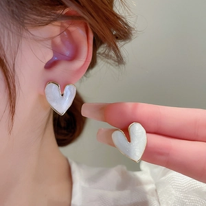 Elegant white enamel heart stud earrings with gold trim and silver needle for women