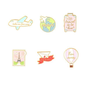 Travel theme enamel badge set featuring plane, globe, and suitcase in macaron colors