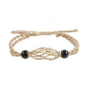 Detailed macro view of beige handmade braided mesh cord necklace with black bead accents