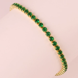 Elegant gold emerald zircon bracelet featuring round green gemstones on a sleek box chain