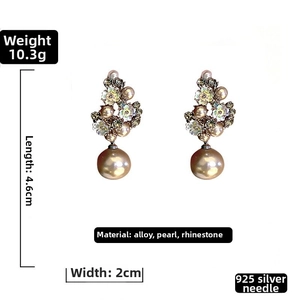 Detail of vintage flower earrings with pearls, crystals, and 925 silver needles