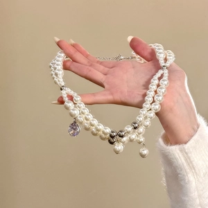 Elegant double-layer pearl necklace with purple zircon water drop pendant for women