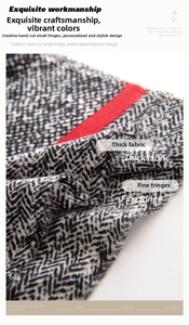Detail of herringbone pattern scarf with red stripes and fine fringe texture