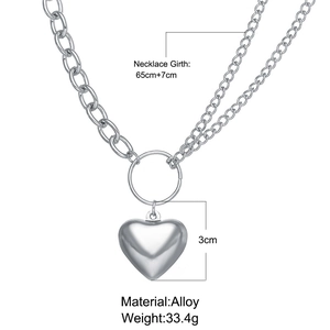 Detail of double-layer silver alloy chain necklace with heart pendant and OT toggle clasp