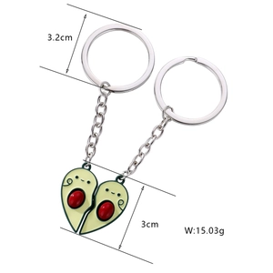 Detail of magnetic heart-shaped avocado couple keychains with enamel finish and size data