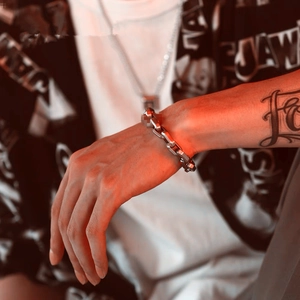 Mens silver stainless steel Cuban link bracelet with a bold geometric square chain design