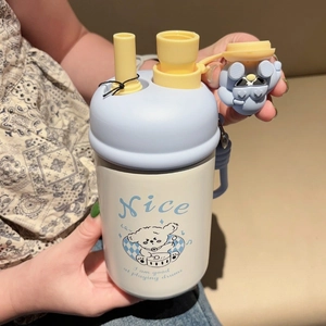 Detail view of the blue cartoon straw thermos featuring dual drinking mouth and a cute lid