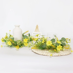 Yellow daisy and eucalyptus candle ring wreath for spring wedding and home decor