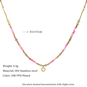 Detail of 18K gold-plated beaded necklace with pink and purple stones and size chart