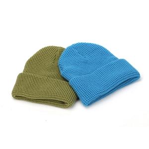 Solid color cuffed knit beanie hats in olive green and bright blue styles