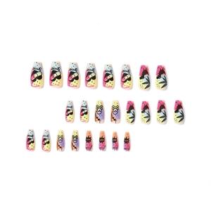 Neon mixed pattern press-on nails featuring heart skull and leaves in long coffin shape