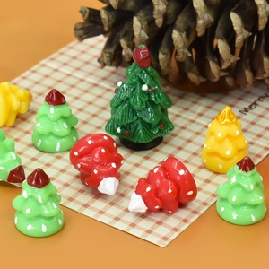 Close-up of colorful resin mini Christmas trees for DIY crafts and festive decor