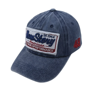 Detail of vintage navy denim baseball cap with New Story patches and 49 embroidery