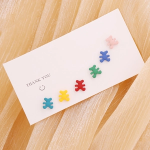Miniature bear earrings set in six vibrant colors displayed on a premium thank you card