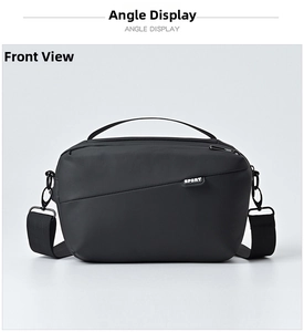 Detail view of black waterproof nylon shoulder bag with adjustable strap and Sport logo
