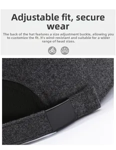 Detail of grey winter baseball cap with adjustable metal buckle and warm wool texture