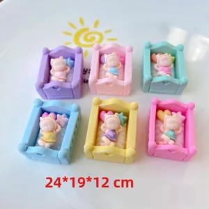 Macro view of miniature resin baby cradle charms in pastel colors 24x19x12mm size