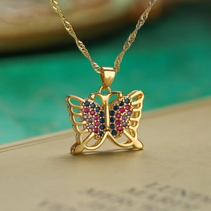 Elegant gold-tone butterfly necklace with vibrant blue and pink pavé crystal stones