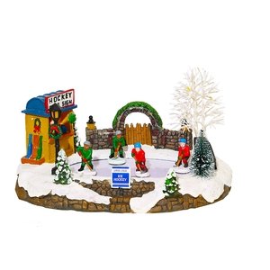 LED lit Christmas winter village hockey scene resin house with moving musical figures