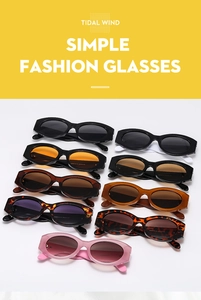Detail shot of wide-frame sunglasses in various colors like tortoise and leopard print