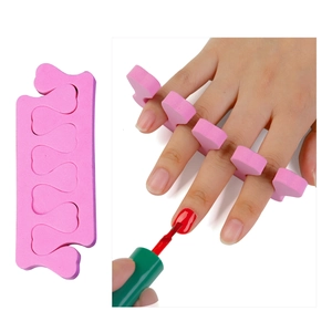 Macro view of pink foam nail separators showing product detail and usage for manicure